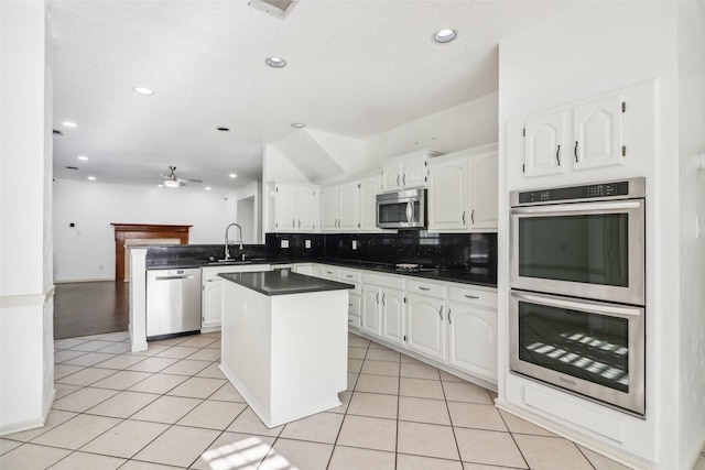 kitchen with white cabinets, ceiling fan, sink, and appliances with stainless steel finishes