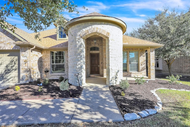 view of exterior entry featuring a garage