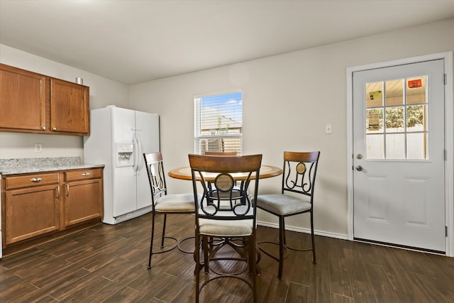 dining room with dark wood-type flooring