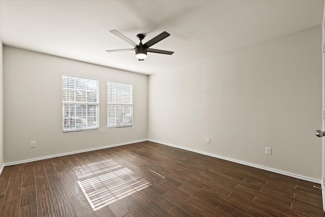 unfurnished room with dark hardwood / wood-style flooring and ceiling fan