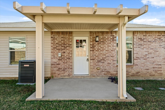 doorway to property featuring central air condition unit