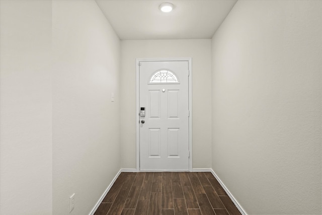 entryway with dark hardwood / wood-style floors