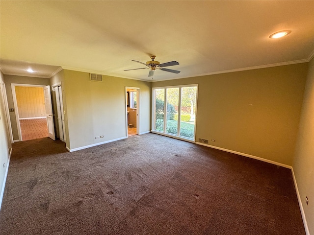 unfurnished room featuring ceiling fan, carpet floors, and crown molding