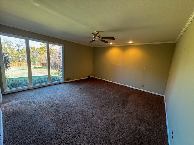 carpeted empty room featuring ceiling fan and crown molding