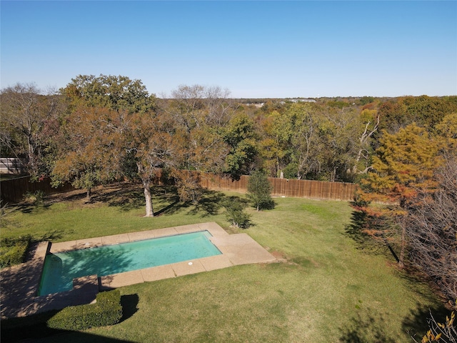 view of swimming pool featuring a lawn and a patio