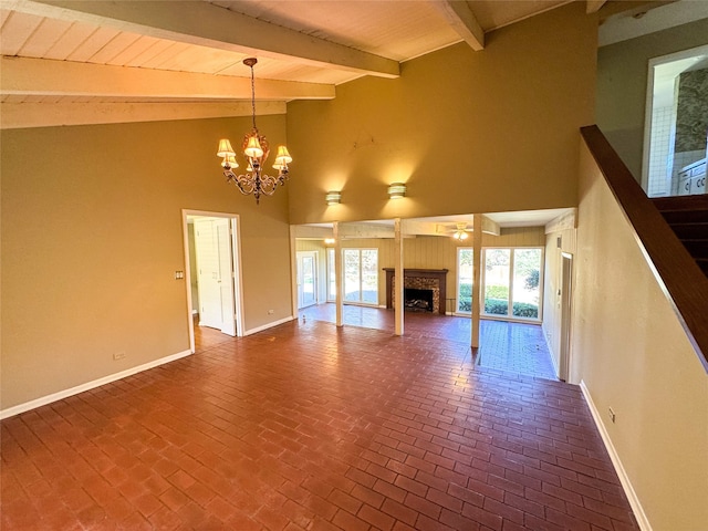 unfurnished living room featuring beam ceiling, ceiling fan with notable chandelier, high vaulted ceiling, and wooden ceiling