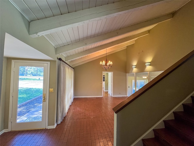 interior space with vaulted ceiling with beams and an inviting chandelier