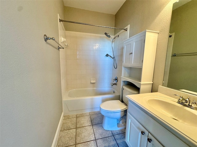 full bathroom with tile patterned floors, vanity, tiled shower / bath combo, and toilet