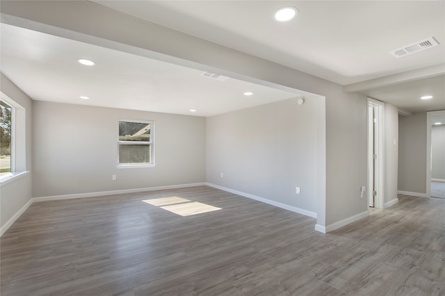 spare room with hardwood / wood-style floors