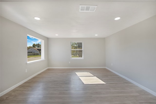 spare room featuring light hardwood / wood-style floors