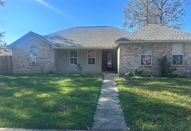 ranch-style home with a front yard