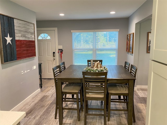 dining area with hardwood / wood-style floors