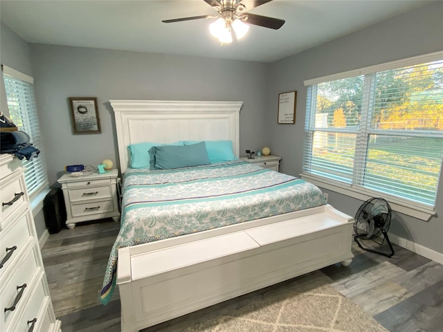 bedroom featuring ceiling fan and dark hardwood / wood-style flooring