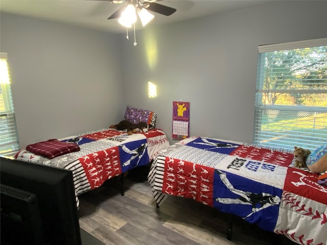 bedroom with hardwood / wood-style flooring and ceiling fan