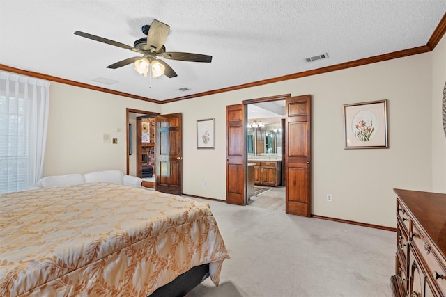 carpeted bedroom with a textured ceiling, connected bathroom, ceiling fan, and ornamental molding