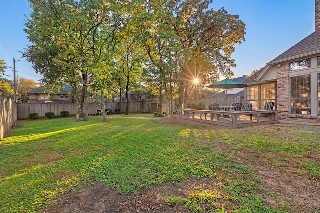 view of yard featuring a wooden deck