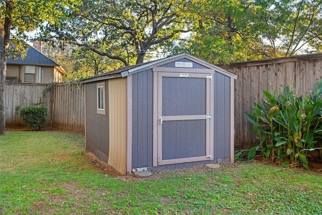 view of outbuilding with a lawn