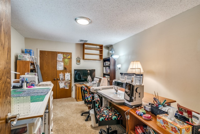 office area featuring carpet flooring and a textured ceiling