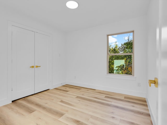 spare room featuring light hardwood / wood-style flooring