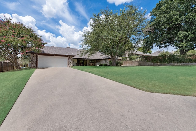 single story home with a garage and a front yard