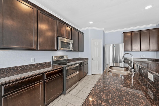 kitchen featuring dark brown cabinets, sink, stainless steel appliances, and crown molding