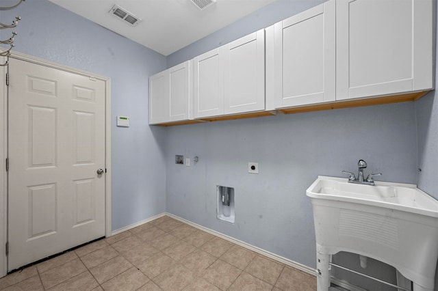 laundry area featuring cabinets, washer hookup, hookup for an electric dryer, and light tile patterned flooring