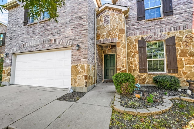 doorway to property featuring a garage