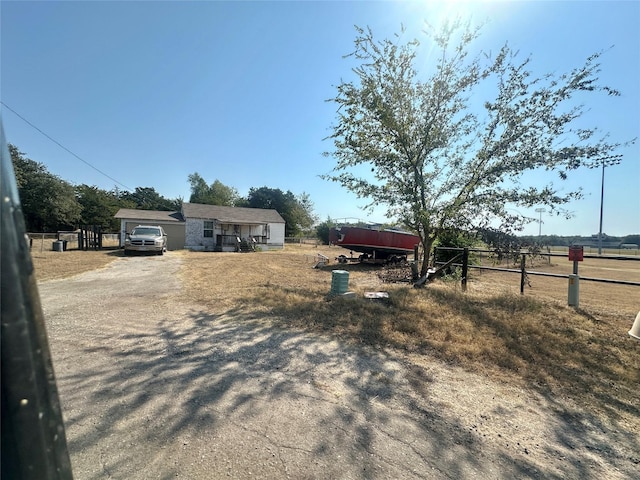 single story home with a rural view