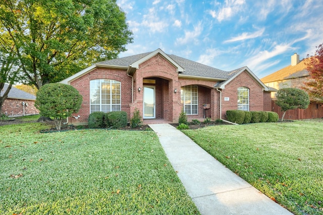 single story home with a front yard