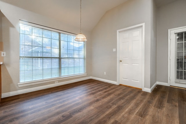 unfurnished dining area featuring a healthy amount of sunlight and dark hardwood / wood-style flooring