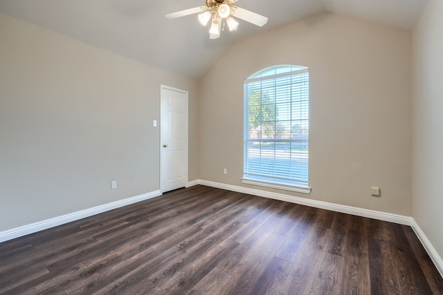 unfurnished room with ceiling fan, dark wood-type flooring, and lofted ceiling