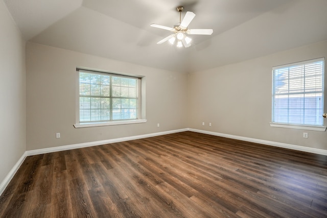 unfurnished room featuring ceiling fan, lofted ceiling, and dark wood-type flooring