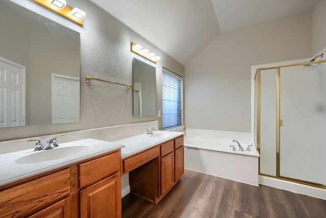 bathroom featuring plus walk in shower, wood-type flooring, vanity, and lofted ceiling