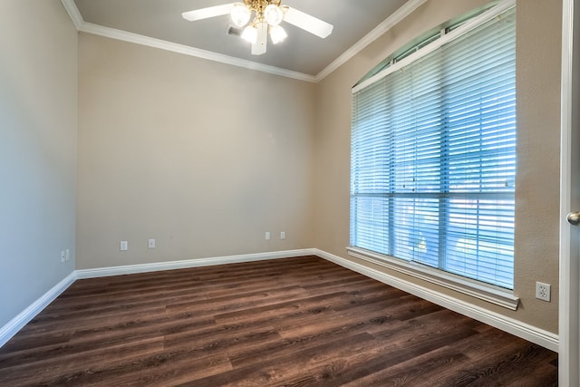 empty room featuring ornamental molding, plenty of natural light, dark wood-type flooring, and ceiling fan