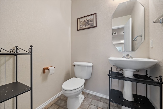 bathroom featuring toilet