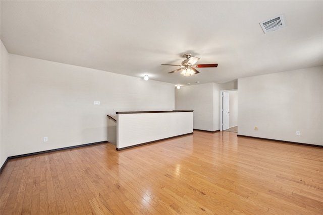 spare room with light hardwood / wood-style floors and ceiling fan