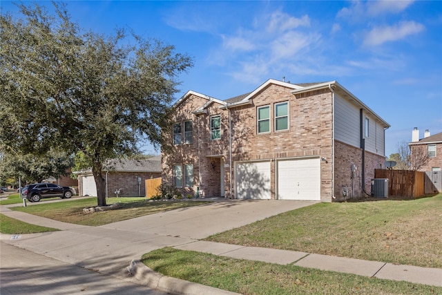 view of front facade with a garage and a front lawn