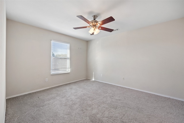 unfurnished room featuring carpet flooring and ceiling fan