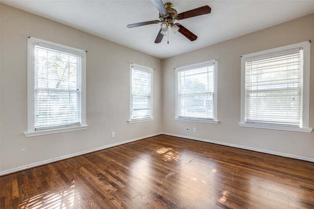 empty room featuring dark hardwood / wood-style floors and ceiling fan