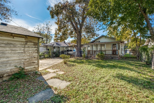 view of yard with covered porch