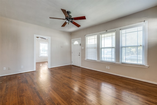 interior space featuring ceiling fan and dark wood-type flooring