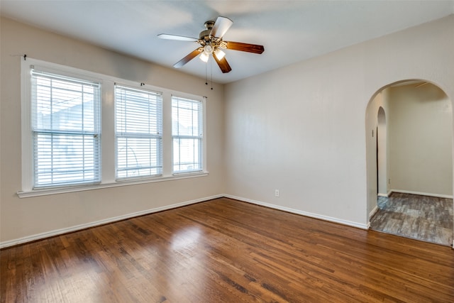 unfurnished room with ceiling fan and hardwood / wood-style floors