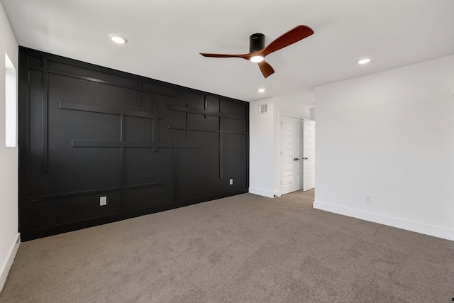 unfurnished bedroom featuring a closet, light colored carpet, and ceiling fan