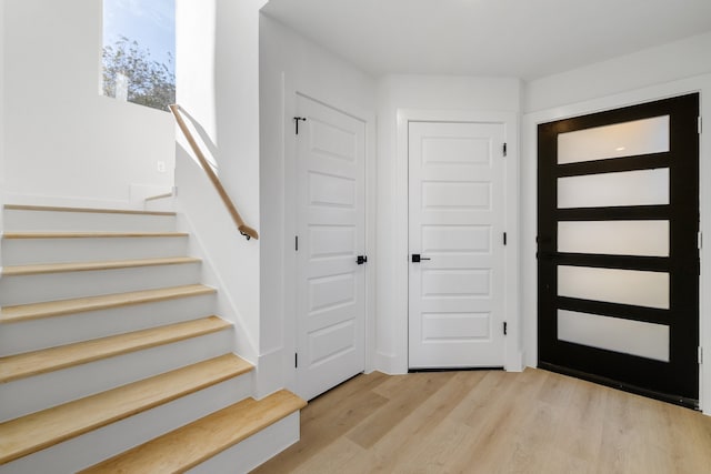 entryway with light hardwood / wood-style floors