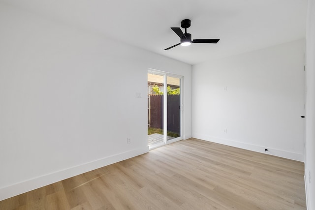 empty room with light wood-type flooring and ceiling fan