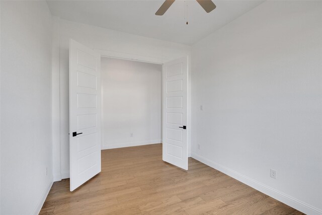 unfurnished bedroom featuring light hardwood / wood-style flooring and ceiling fan