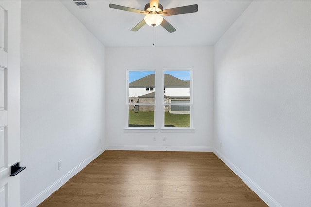 unfurnished room featuring ceiling fan and wood-type flooring