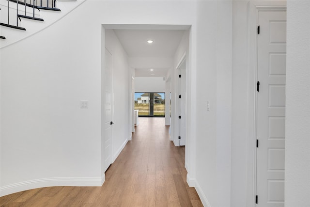 corridor featuring light hardwood / wood-style flooring