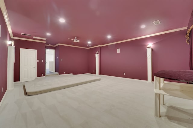 home theater featuring light colored carpet and crown molding