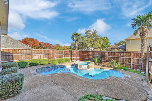 view of pool featuring a patio area and an in ground hot tub